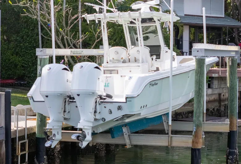 Dan's Seachelle Yacht Photos Pics 2019 Edgewater 320CC boat with dual engines on a lift.