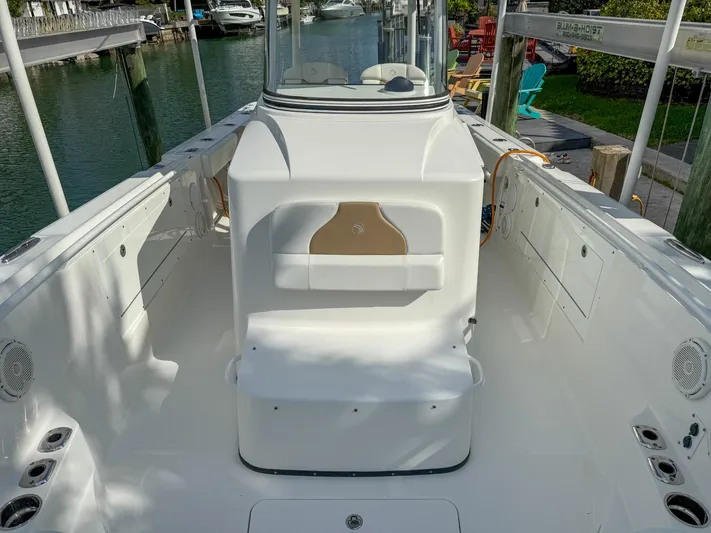 Dan's Seachelle Yacht Photos Pics 2019 Edgewater 320CC boat interior, featuring spacious deck and seating area.