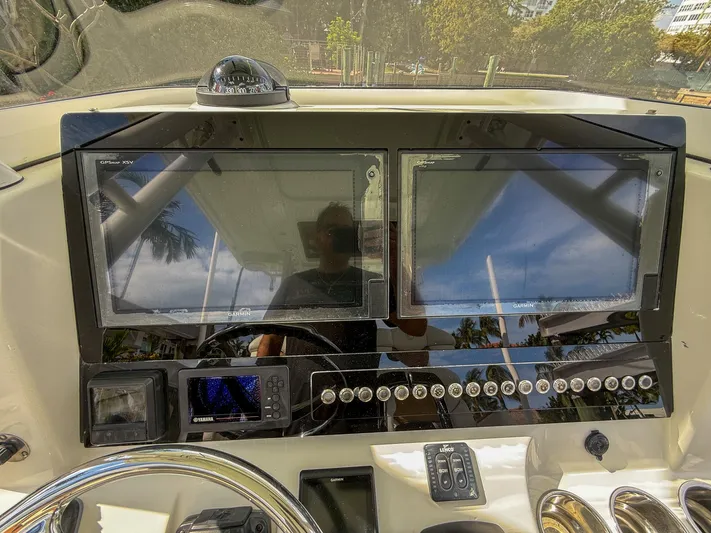 Dan's Seachelle Yacht Photos Pics Edgewater 320CC 2019 dashboard with dual screens and control panel.