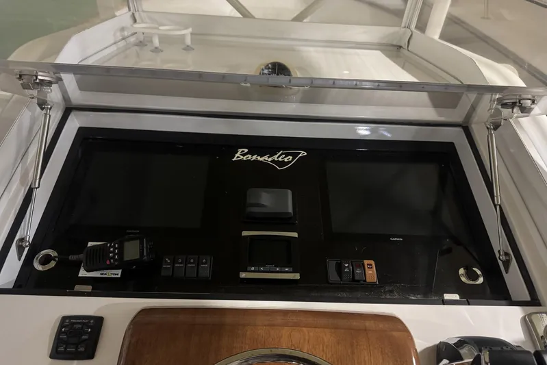 Dasher Yacht Photos Pics 2009 Bonadeo 34 Cuddy helm with navigation controls and display screens.