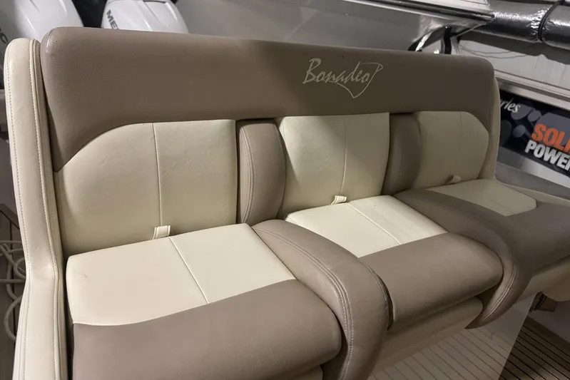 Dasher Yacht Photos Pics 2009 Bonadeo 34 Cuddy boat seating with beige and cream upholstery.