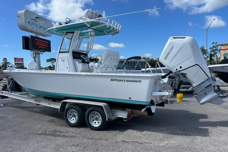  Yacht Photos Pics 2026 Sportsman Masters 247 Bay Boat on trailer, featuring Mercury outboard engine.