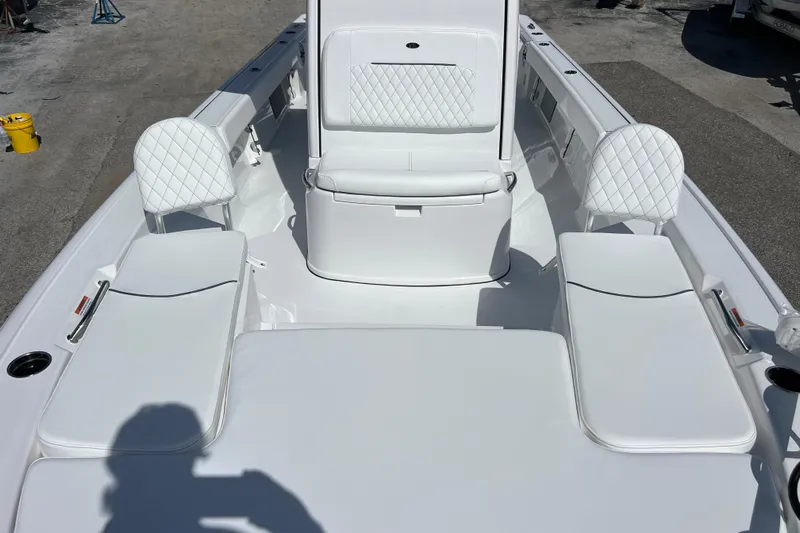  Yacht Photos Pics 2026 Sportsman Masters 247 Bay Boat interior with white cushioned seating.