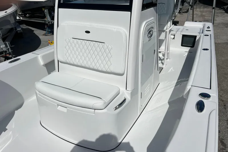  Yacht Photos Pics 2026 Sportsman Masters 247 Bay Boat with white seating and sleek design.