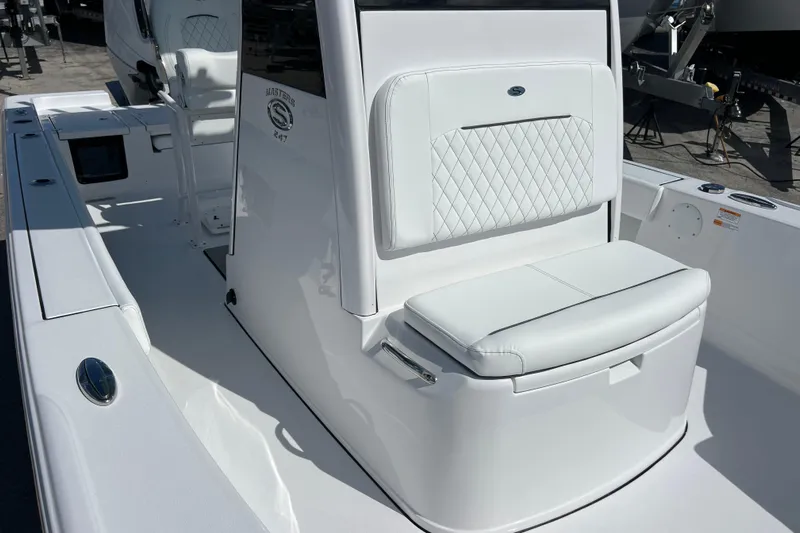  Yacht Photos Pics 2026 Sportsman Masters 247 Bay Boat with white cushioned seating and sleek design.