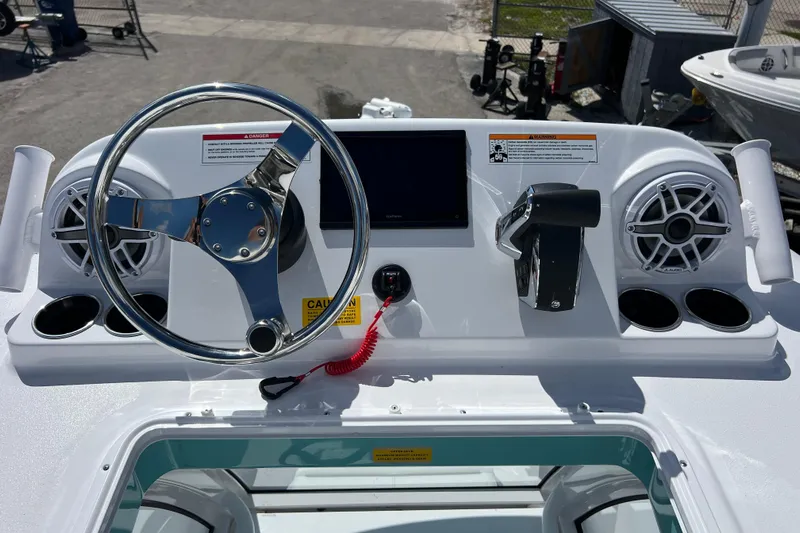  Yacht Photos Pics 2026 Sportsman Masters 247 Bay Boat dashboard with steering wheel and controls.