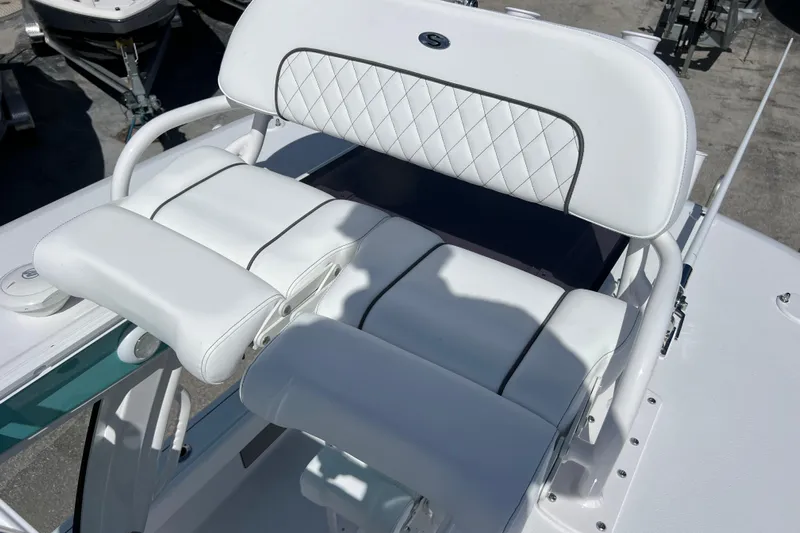  Yacht Photos Pics 2026 Sportsman Masters 247 Bay Boat with white cushioned seating and sleek design.