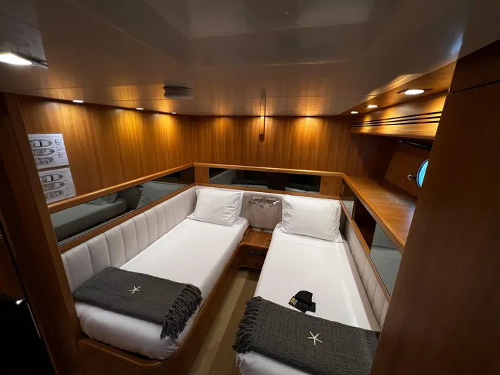 Koko Yacht Photos Pics Luxurious twin cabin interior of 2006 Sanlorenzo SL72 yacht with wooden finish.