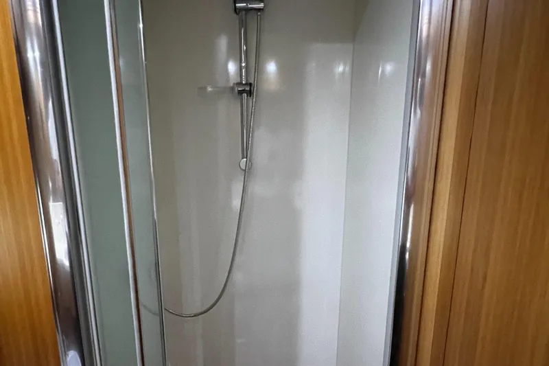 Koko Yacht Photos Pics Shower area in 2006 Sanlorenzo SL72 yacht with wooden trim.