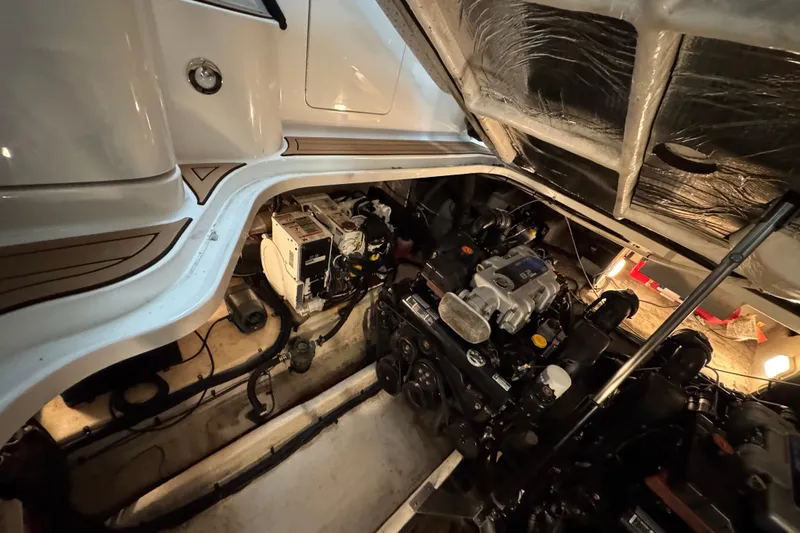  Yacht Photos Pics Engine compartment of a 2011 Sea Ray 370 Sundancer boat, showcasing mechanical components.