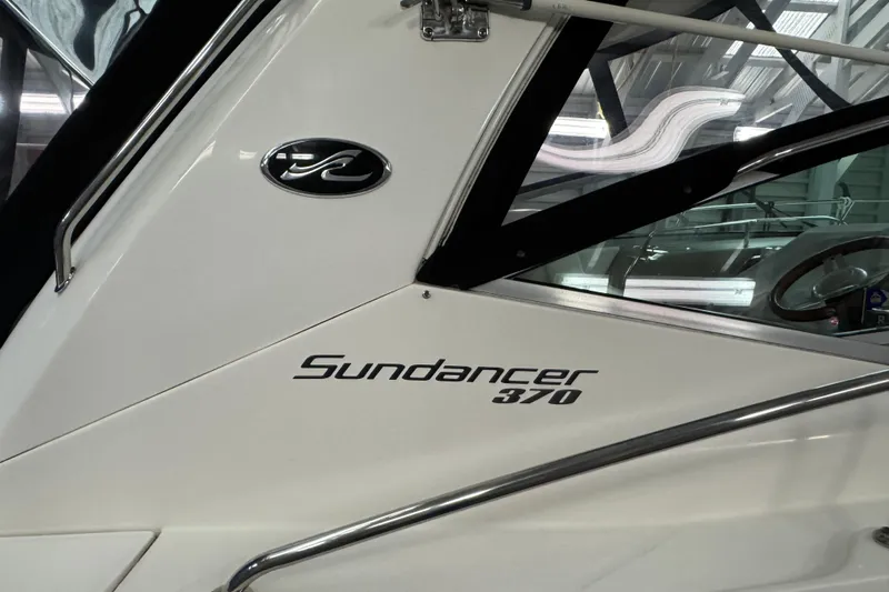  Yacht Photos Pics 2011 Sea Ray 370 Sundancer boat, sleek design with logo and model name visible.