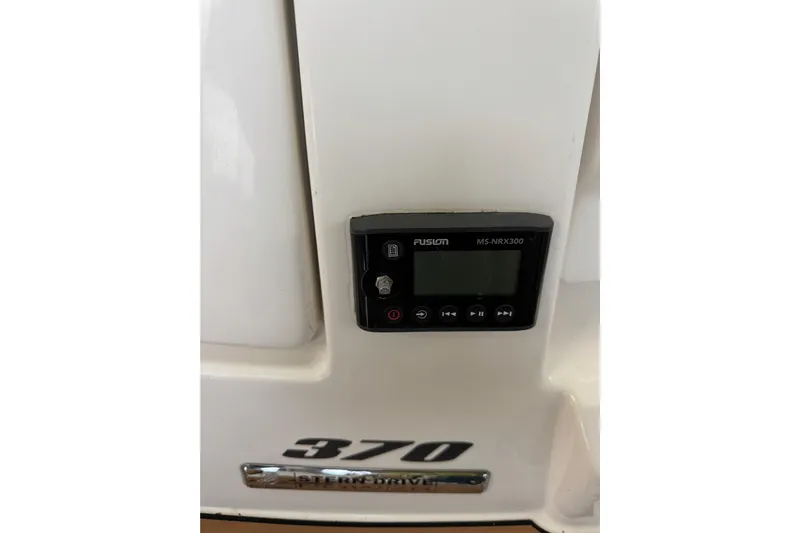  Yacht Photos Pics Control panel on 2011 Sea Ray 370 Sundancer boat, featuring Fusion MS-NRX300.