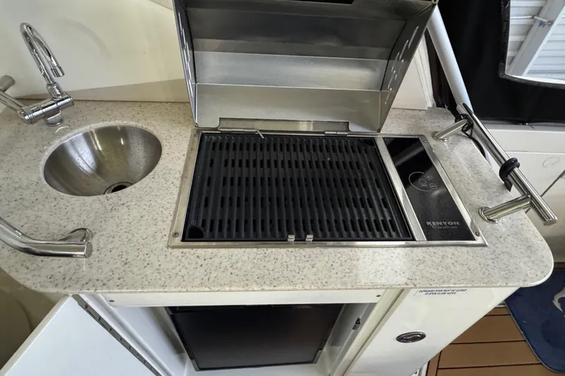  Yacht Photos Pics Outdoor kitchen on 2011 Sea Ray 370 Sundancer with sink and Kenyon grill.