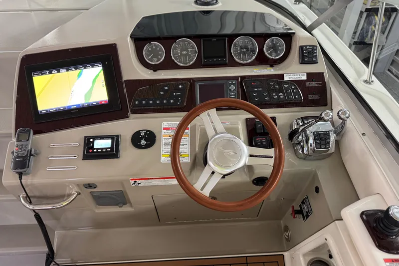  Yacht Photos Pics 2011 Sea Ray 370 Sundancer helm with navigation display and control panel.