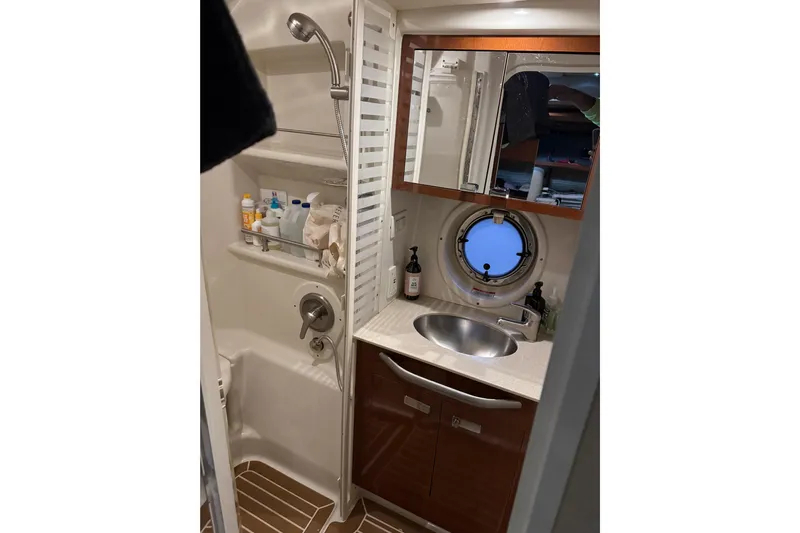  Yacht Photos Pics Bathroom interior of 2011 Sea Ray 370 Sundancer yacht with shower and sink.