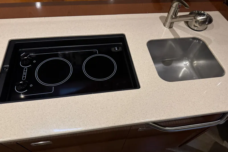  Yacht Photos Pics 2011 Sea Ray 370 Sundancer kitchen with stovetop and sink.