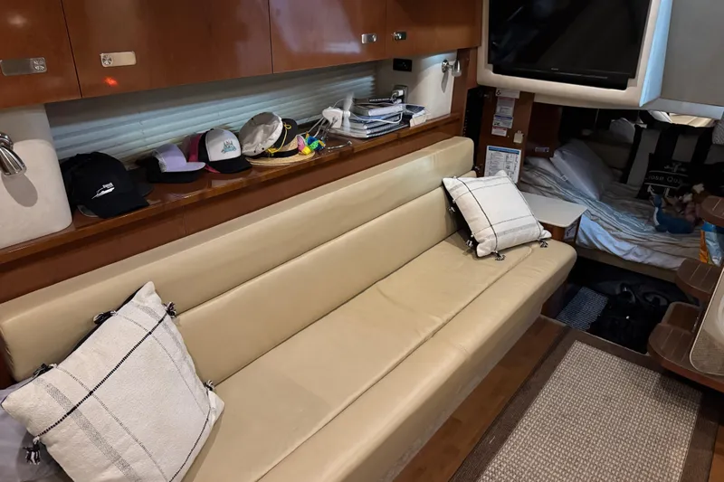  Yacht Photos Pics Interior of 2011 Sea Ray 370 Sundancer with beige seating and decorative pillows.