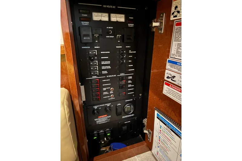  Yacht Photos Pics Electrical control panel inside 2011 Sea Ray 370 Sundancer boat, featuring various switches and labels.