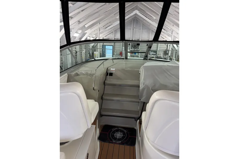  Yacht Photos Pics Interior view of 2011 Sea Ray 370 Sundancer yacht, featuring helm and seating area.