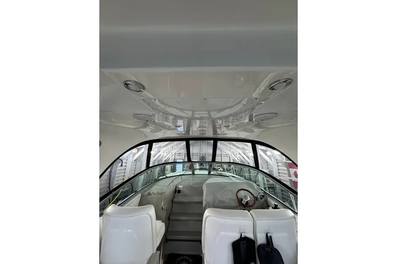  Yacht Photos Pics Interior view of 2011 Sea Ray 370 Sundancer yacht cockpit with white seating.