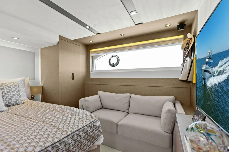 Radiant Yacht Photos Pics Luxurious 2019 Prestige 630 Flybridge yacht bedroom with modern decor and ocean view.