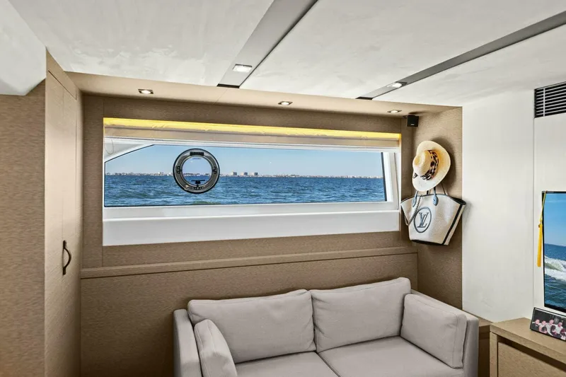 Radiant Yacht Photos Pics Interior of 2019 Prestige 630 Flybridge yacht with ocean view through window.