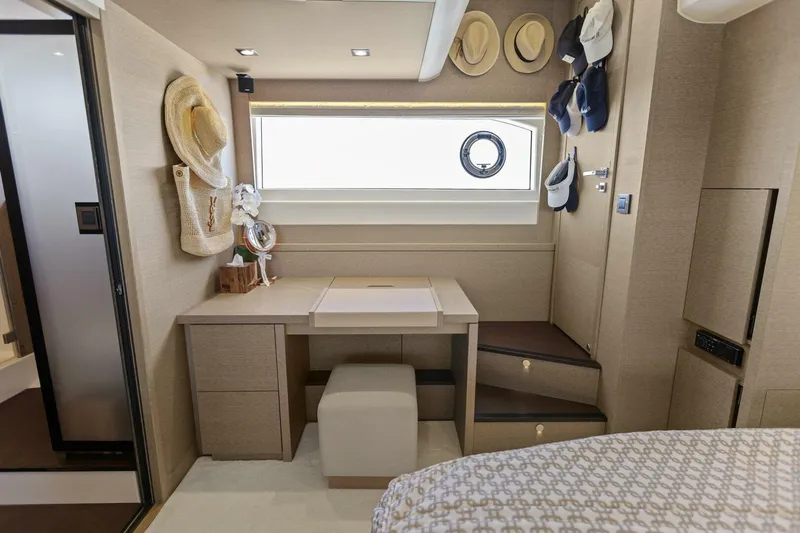 Radiant Yacht Photos Pics Luxurious 2019 Prestige 630 Flybridge cabin with elegant decor and stylish hat display.