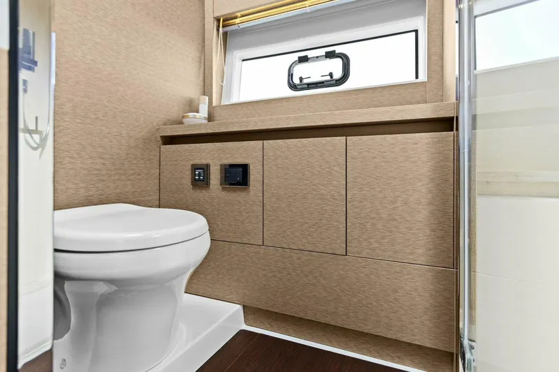 Radiant Yacht Photos Pics Luxurious bathroom in 2019 Prestige 630 Flybridge yacht with modern fixtures.