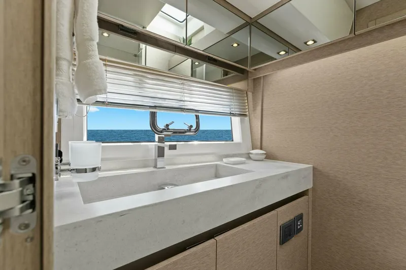 Radiant Yacht Photos Pics Luxurious bathroom on 2019 Prestige 630 Flybridge yacht with ocean view.