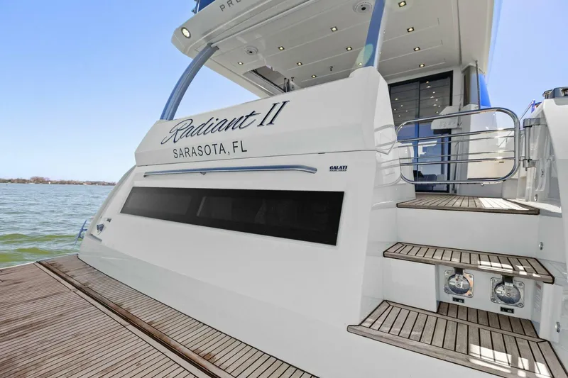 Radiant Yacht Photos Pics Prestige 630 Flybridge 2019 yacht docked, featuring elegant design and Sarasota, FL registration.