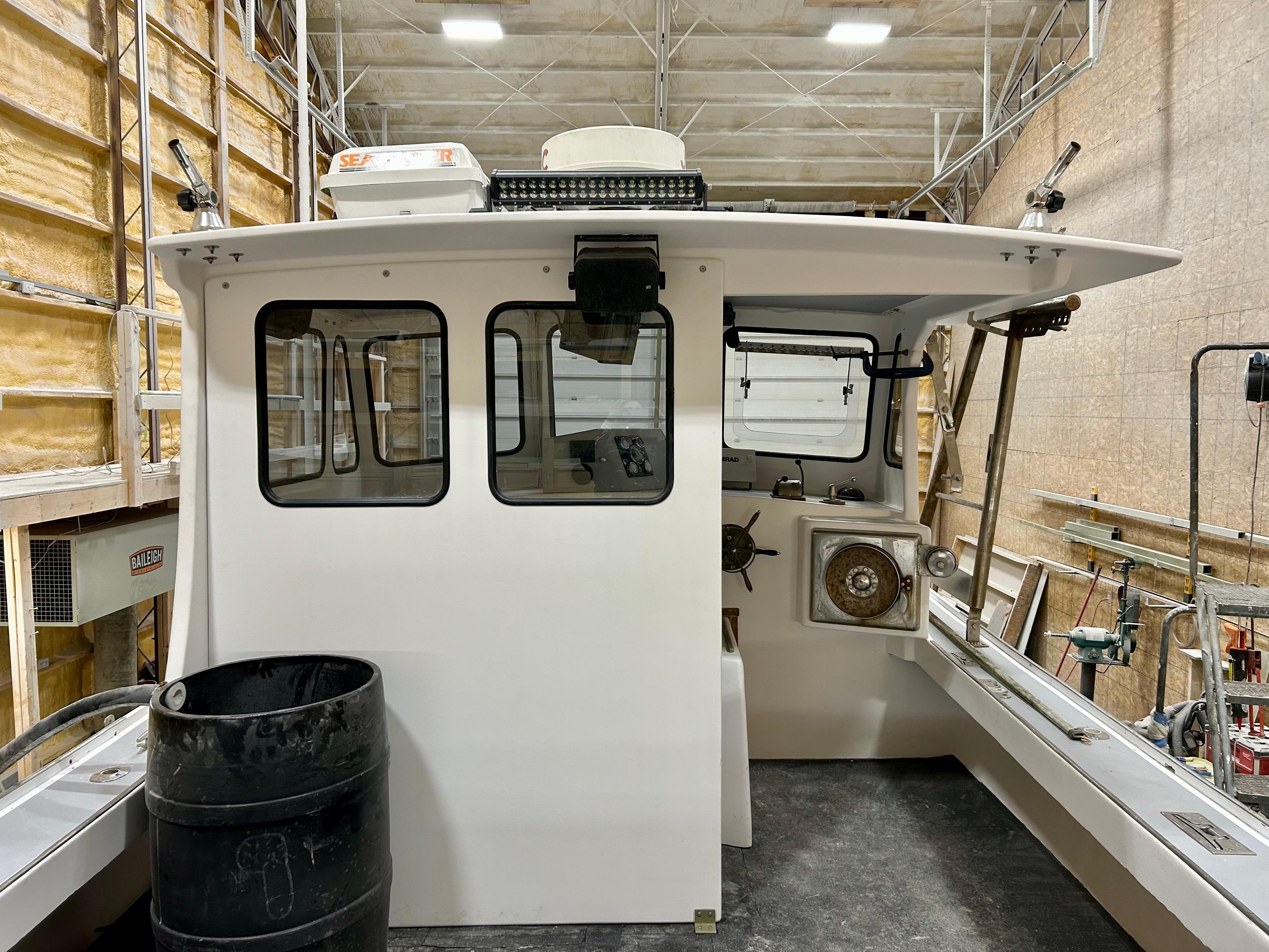 1980 Holland 32 boat interior in a workshop setting.