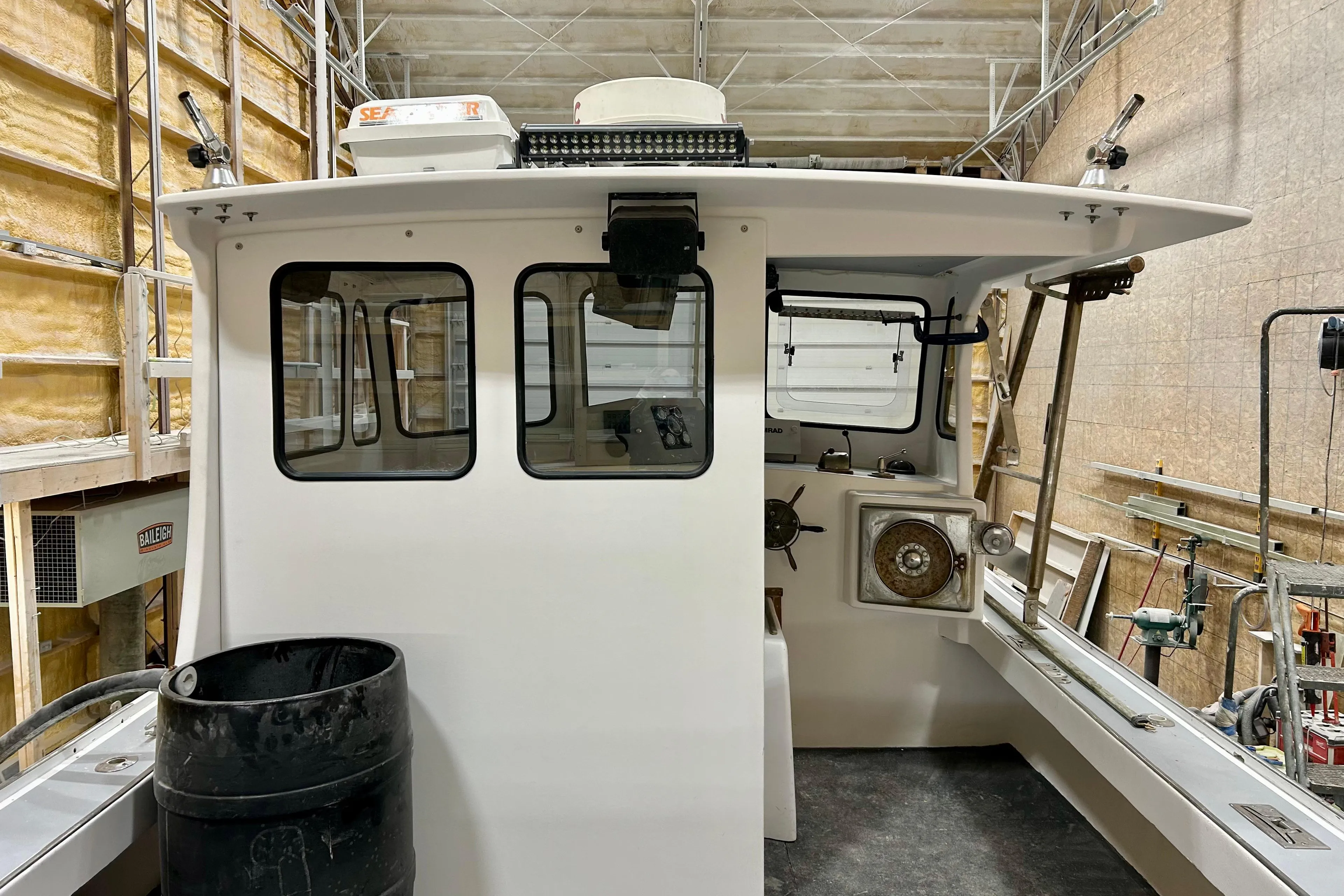 1980 Holland 32 boat interior in a workshop setting.