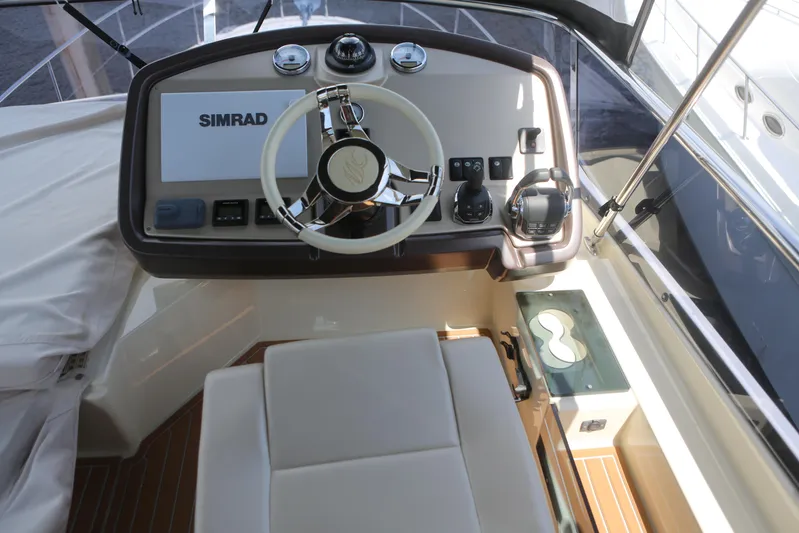 Integrity Yacht Photos Pics 2017 Beneteau Monte Carlo 4 helm with Simrad navigation system and modern controls.