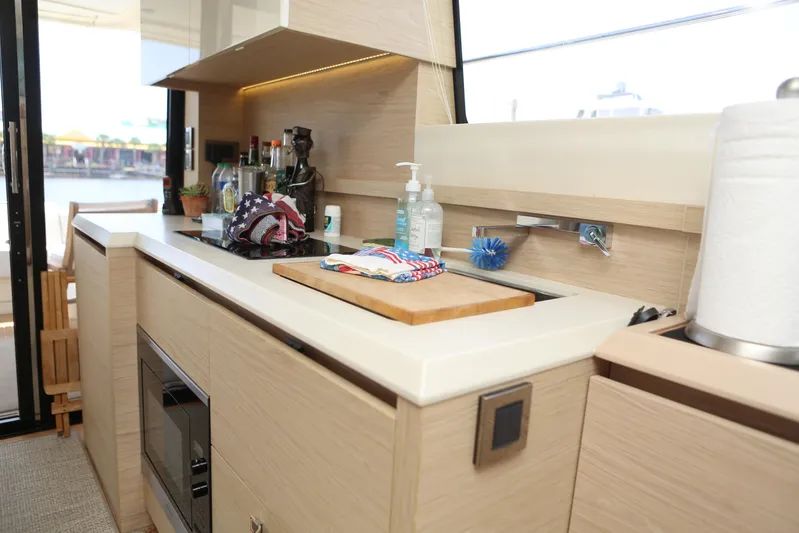 Integrity Yacht Photos Pics Modern kitchen interior on 2017 Beneteau Monte Carlo 4 yacht, featuring sleek countertops and appliances.
