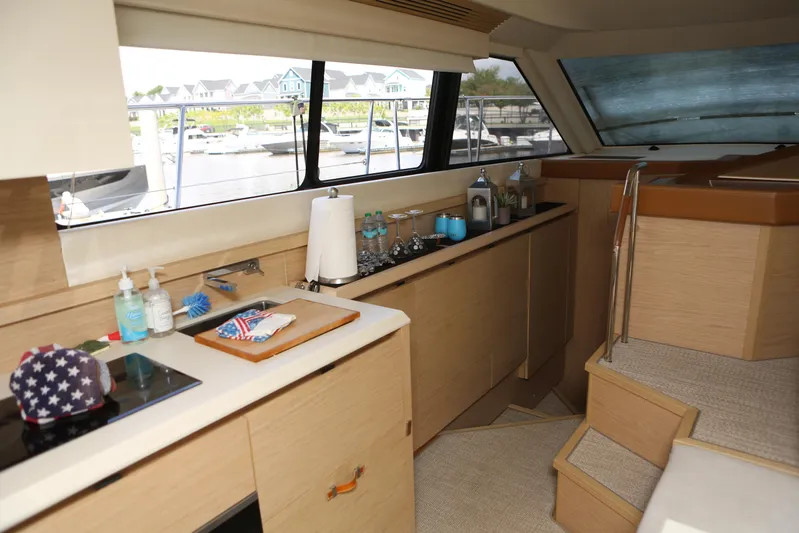 Integrity Yacht Photos Pics 2017 Beneteau Monte Carlo 4 yacht interior with modern kitchen and scenic marina view.