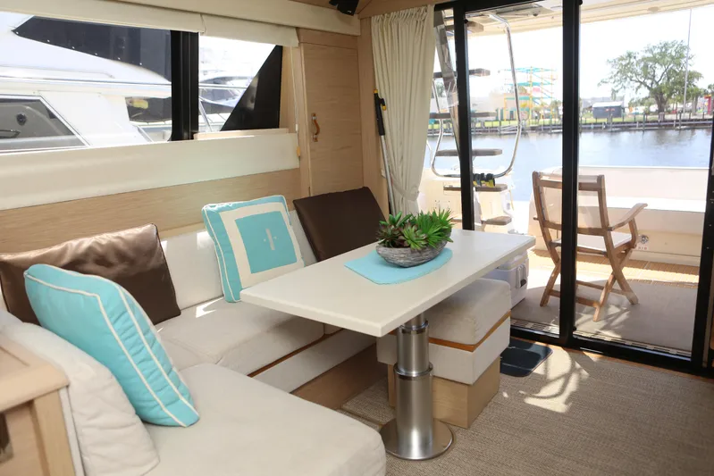 Integrity Yacht Photos Pics Interior of 2017 Beneteau Monte Carlo 4 yacht with cozy seating and table.