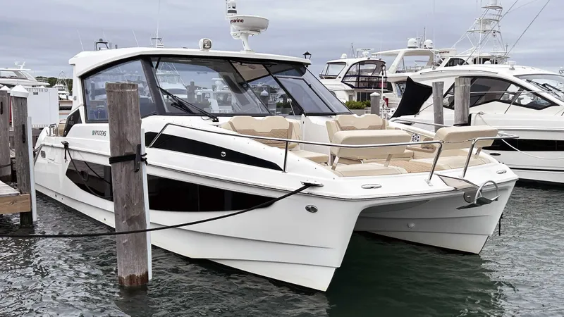  Yacht Photos Pics Aquila 36 Sport 2021 boat docked at marina, featuring sleek design and spacious seating.