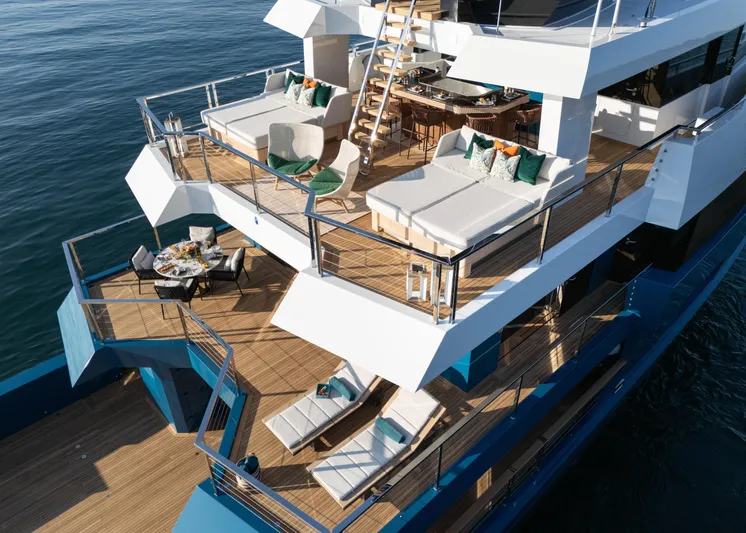 King Benji Yacht Photos Pics Luxurious 2024 Dunya Yachts model with spacious decks and elegant outdoor seating.