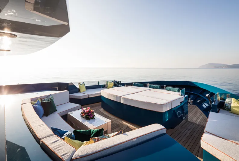 King Benji Yacht Photos Pics Luxurious 2024 Dunya Yachts deck with elegant seating and ocean view.