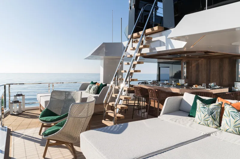 King Benji Yacht Photos Pics Luxurious 2024 Dunya Yachts deck with elegant seating, ocean view, and modern design.