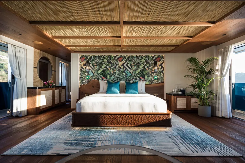 King Benji Yacht Photos Pics Luxurious bedroom interior on 2024 Dunya Yacht, featuring elegant decor and natural lighting.