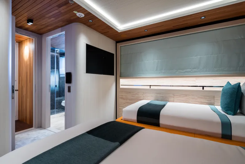 King Benji Yacht Photos Pics Luxurious 2024 Dunya Yachts cabin interior with modern design and twin beds.