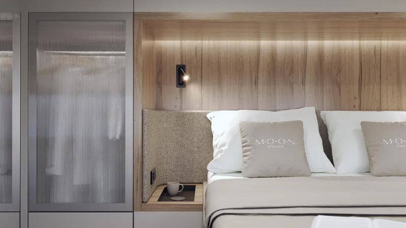 Moon 60 Power Arctic Moon Yacht Photos Pics Luxurious Moon 60 Power yacht bedroom interior, featuring elegant wood paneling and cozy bedding, 2025 model.