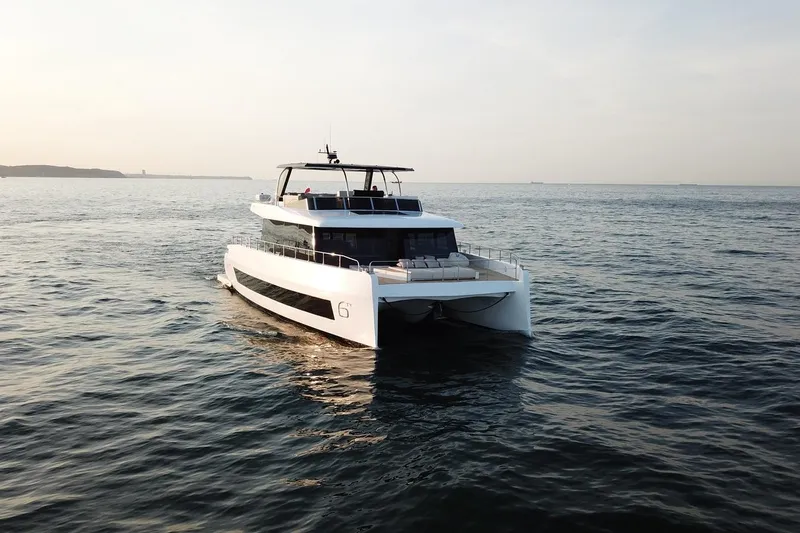 Moon 60 Power Arctic Moon Yacht Photos Pics Luxurious 2025 Moon 60 Power yacht cruising on serene ocean waters at sunset.