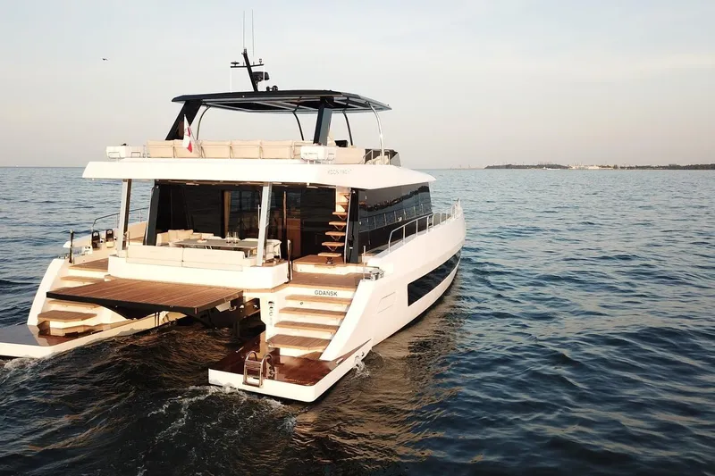 Moon 60 Power Arctic Moon Yacht Photos Pics Luxurious 2025 Moon 60 Power yacht cruising on open sea.