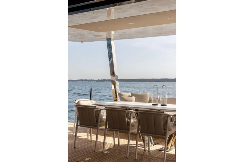 Moon 60 Power Arctic Moon Yacht Photos Pics Luxury yacht deck with seating, Moon 60 Power 2025, overlooking serene ocean view.