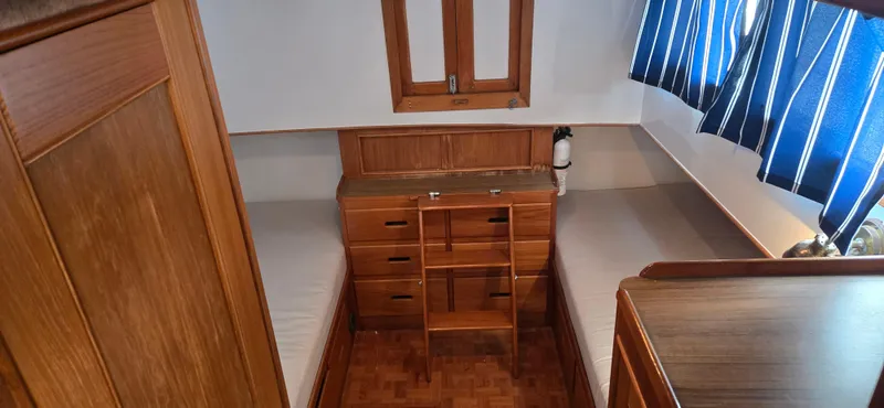 Interlude Yacht Photos Pics 1987 Grand Banks 36 Classic cabin interior with wood finish and twin beds.