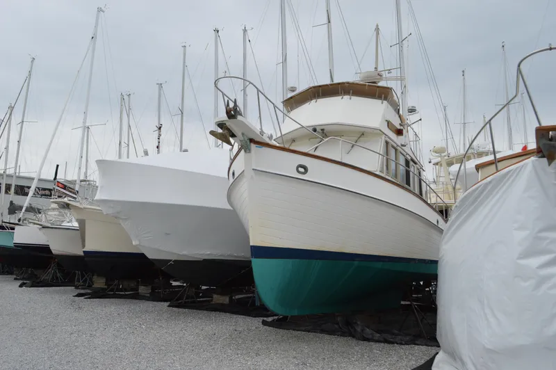 Interlude Yacht Photos Pics 1987 Grand Banks 36 Classic yacht on dry dock, surrounded by other boats.