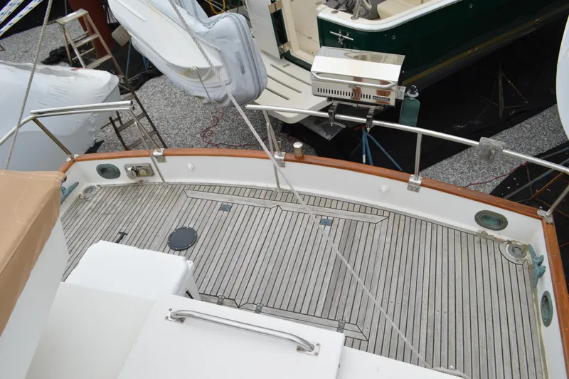 Interlude Yacht Photos Pics 1987 Grand Banks 36 Classic yacht deck with wooden flooring and railing.