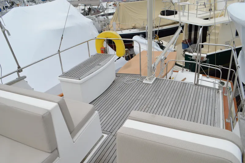 Interlude Yacht Photos Pics 1987 Grand Banks 36 Classic yacht deck with seating and safety equipment.